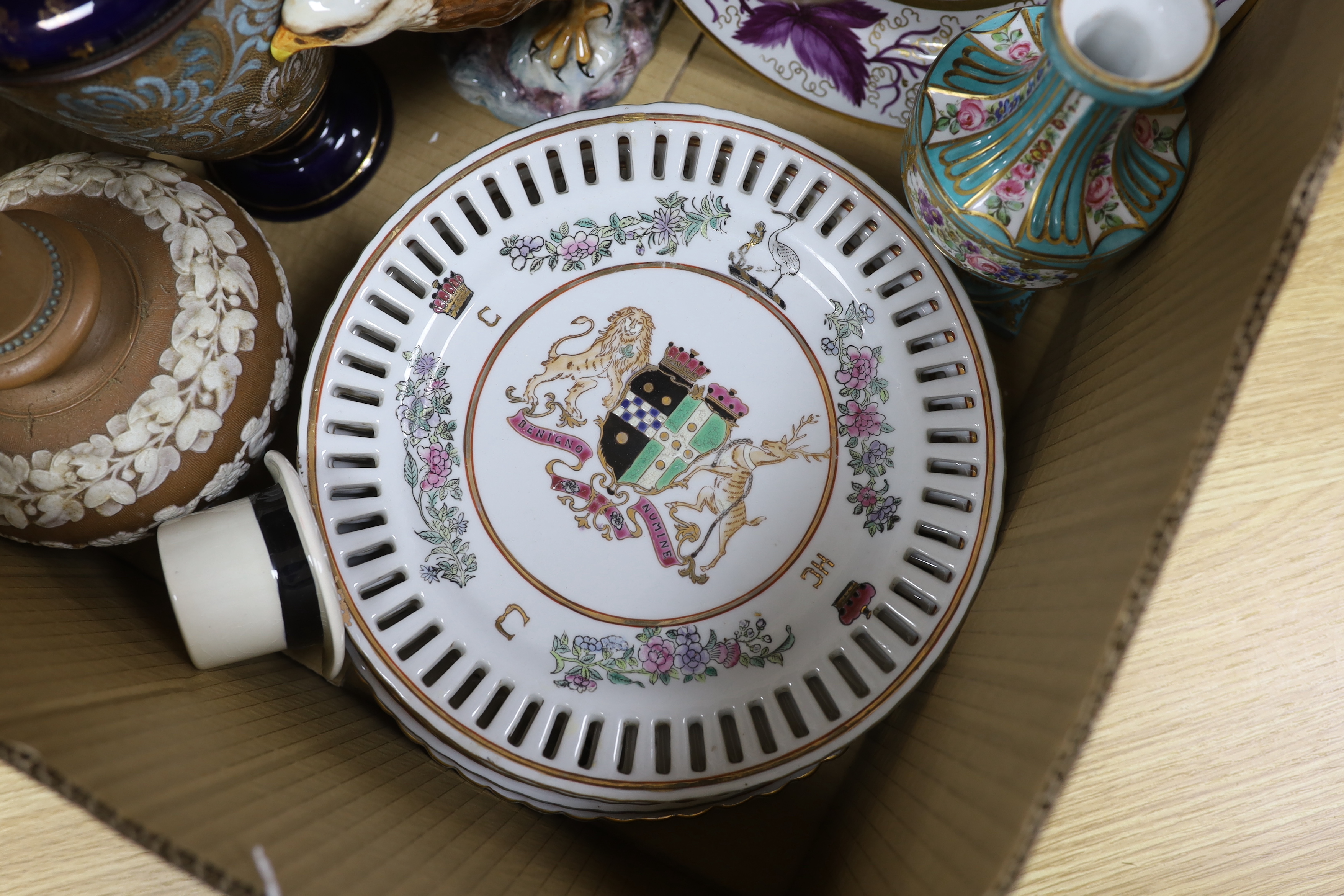 Two Doulton vases, a Beswick eagle, armorial plates, a vase and an advertising top hat